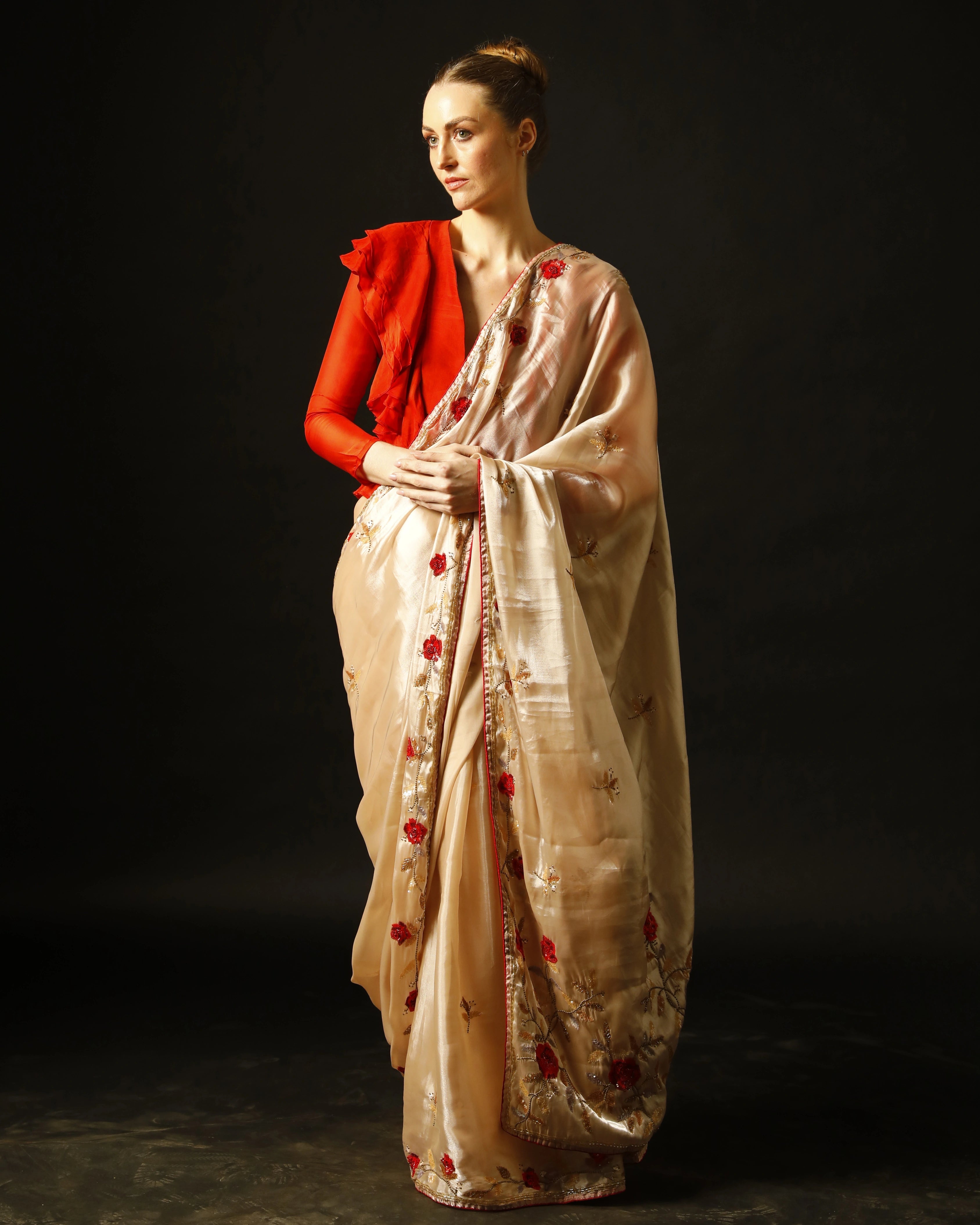 Cream Silk Saree with All-Over Hand Embroidery and Red Tailored Ruffle Blouse