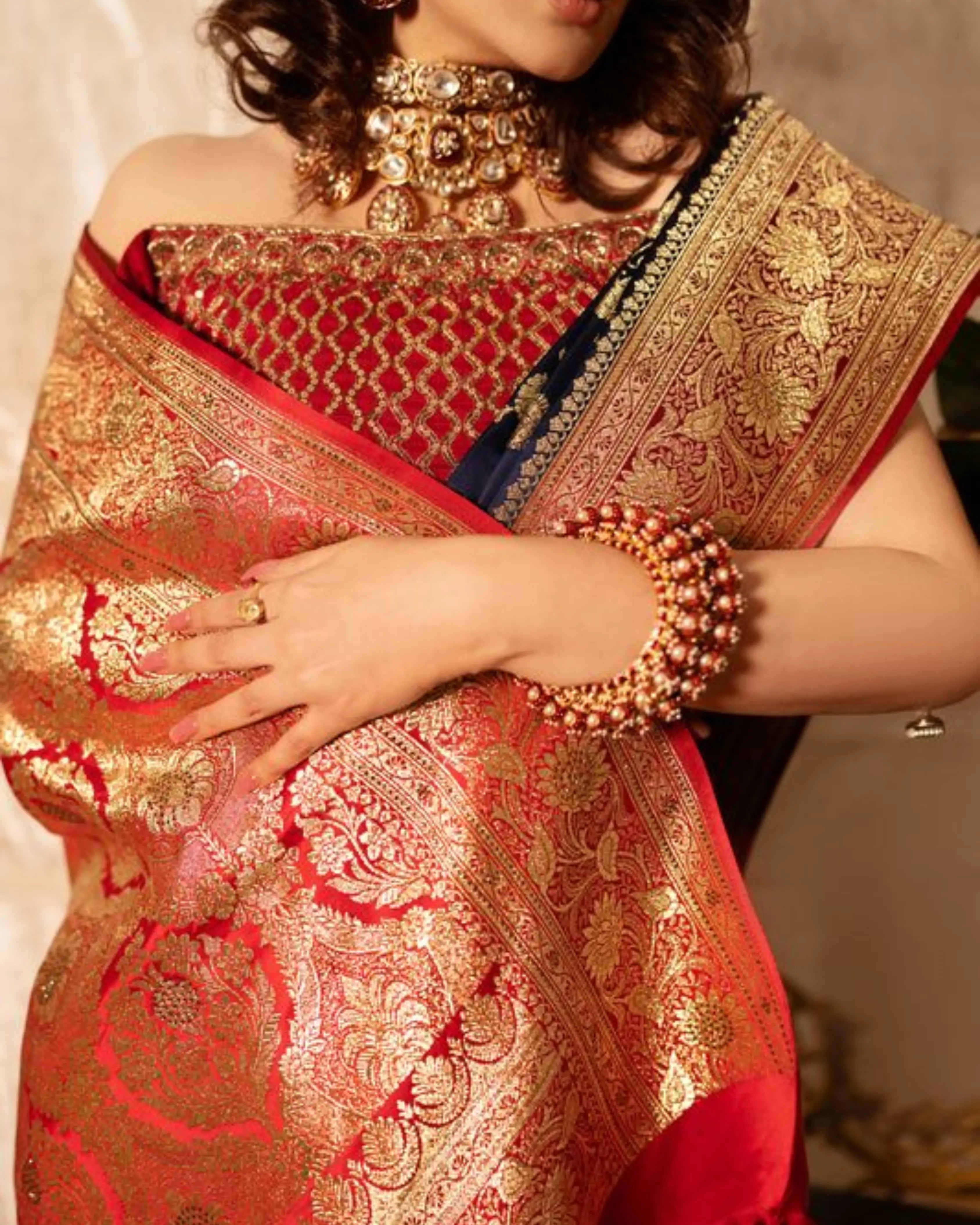 Red and Blue Dual Tone Pure Banarasi Saree with All-Over Floral and Hand Embroidery Border.