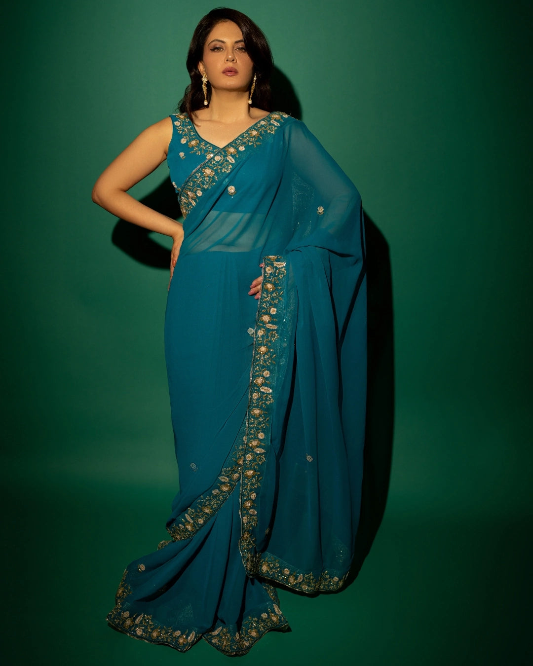 Peacock Blue Hand Embroidered Georgette Saree and Matching Floral Embroidered Blouse