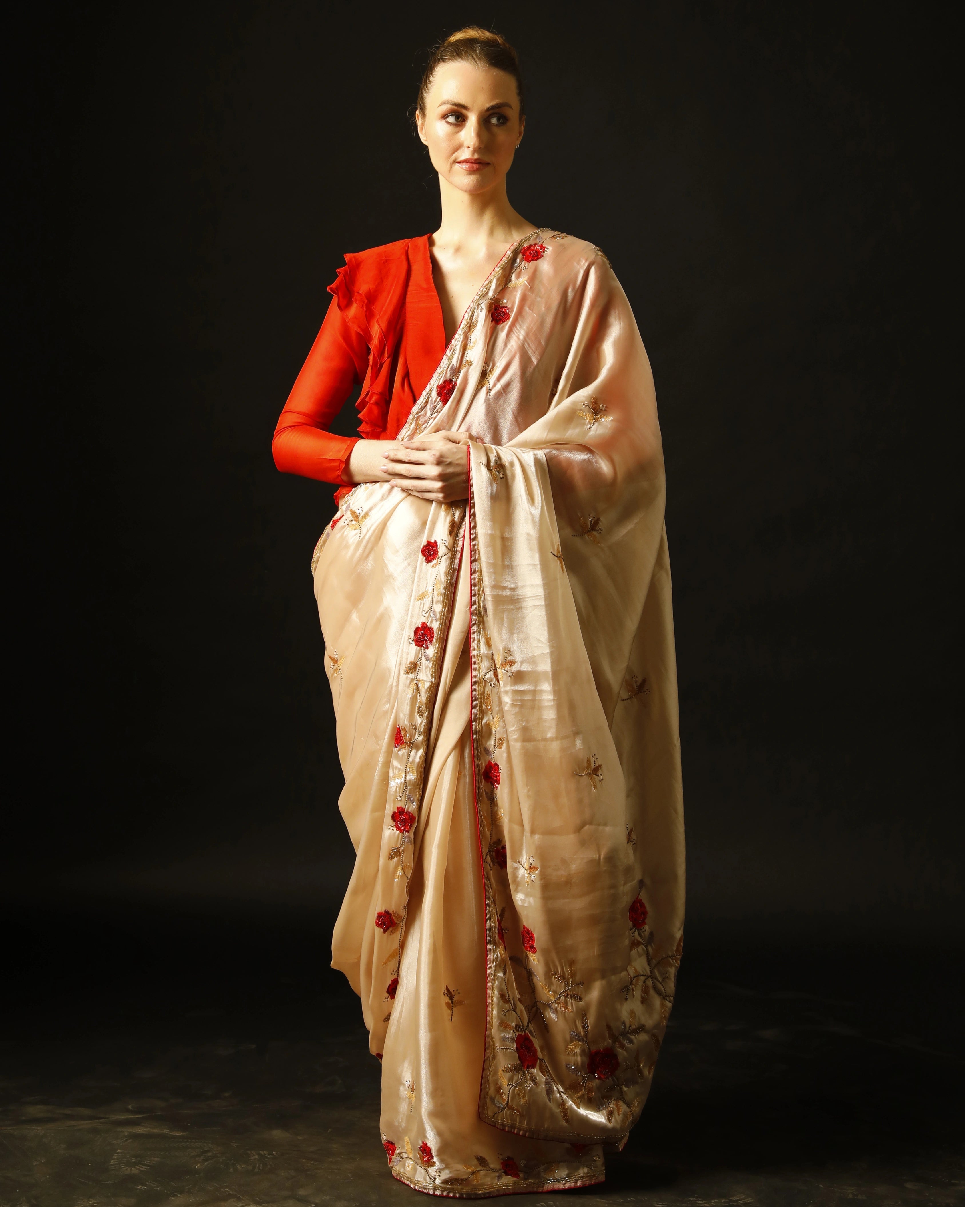 Cream Silk Saree with All-Over Hand Embroidery and Red Tailored Ruffle Blouse