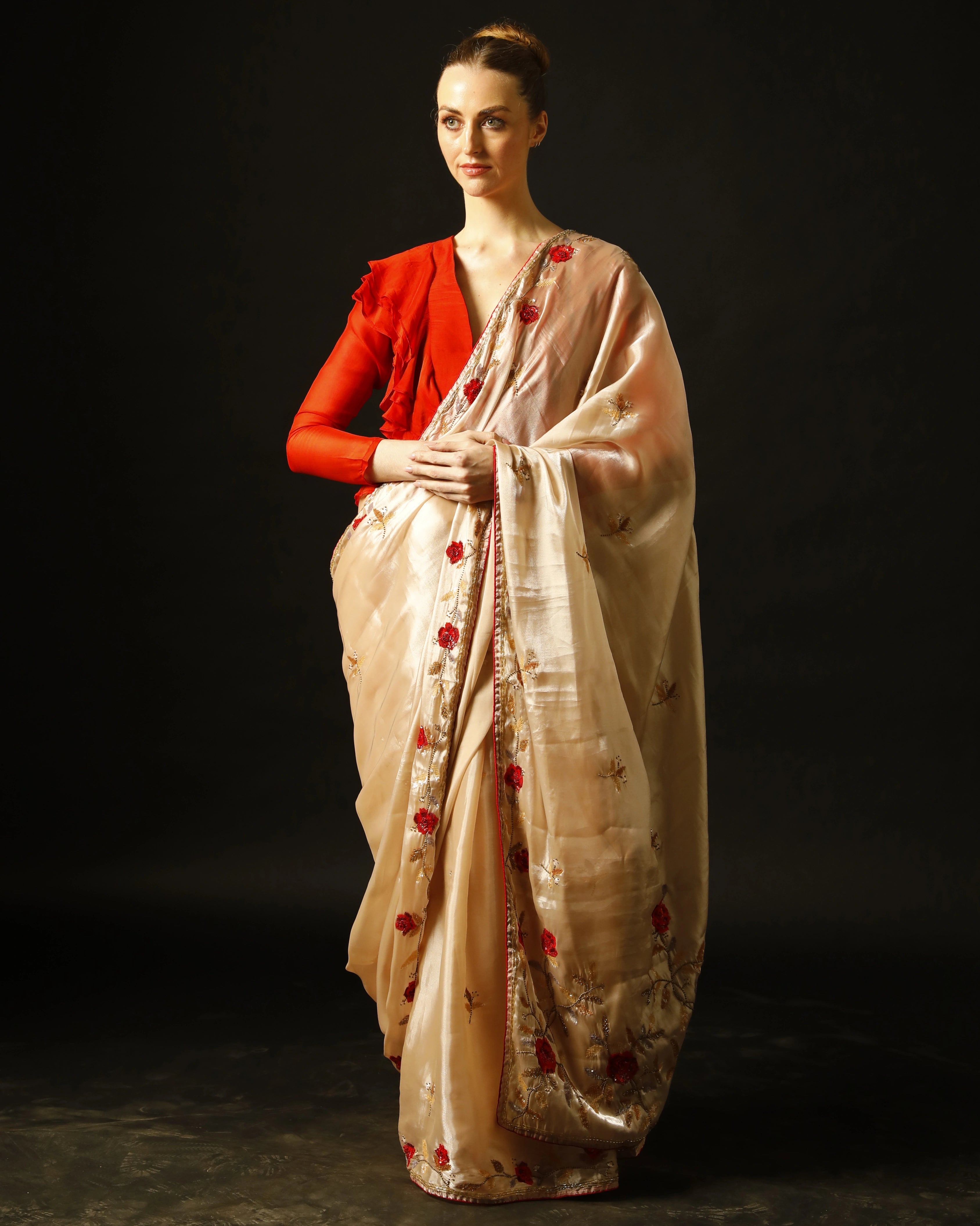 Cream Silk Saree with All-Over Hand Embroidery and Red Tailored Ruffle Blouse