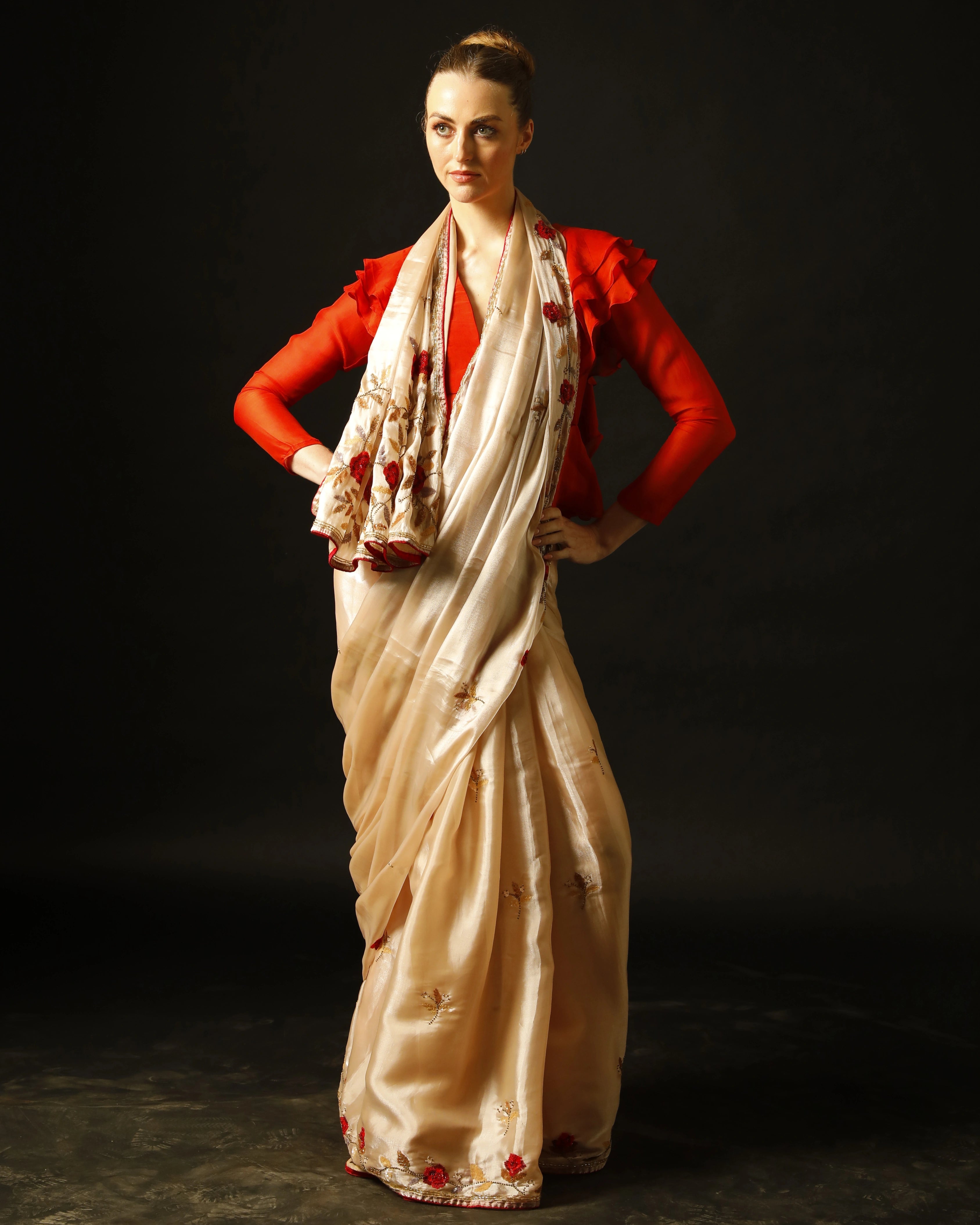 Cream Silk Saree with All-Over Hand Embroidery and Red Tailored Ruffle Blouse