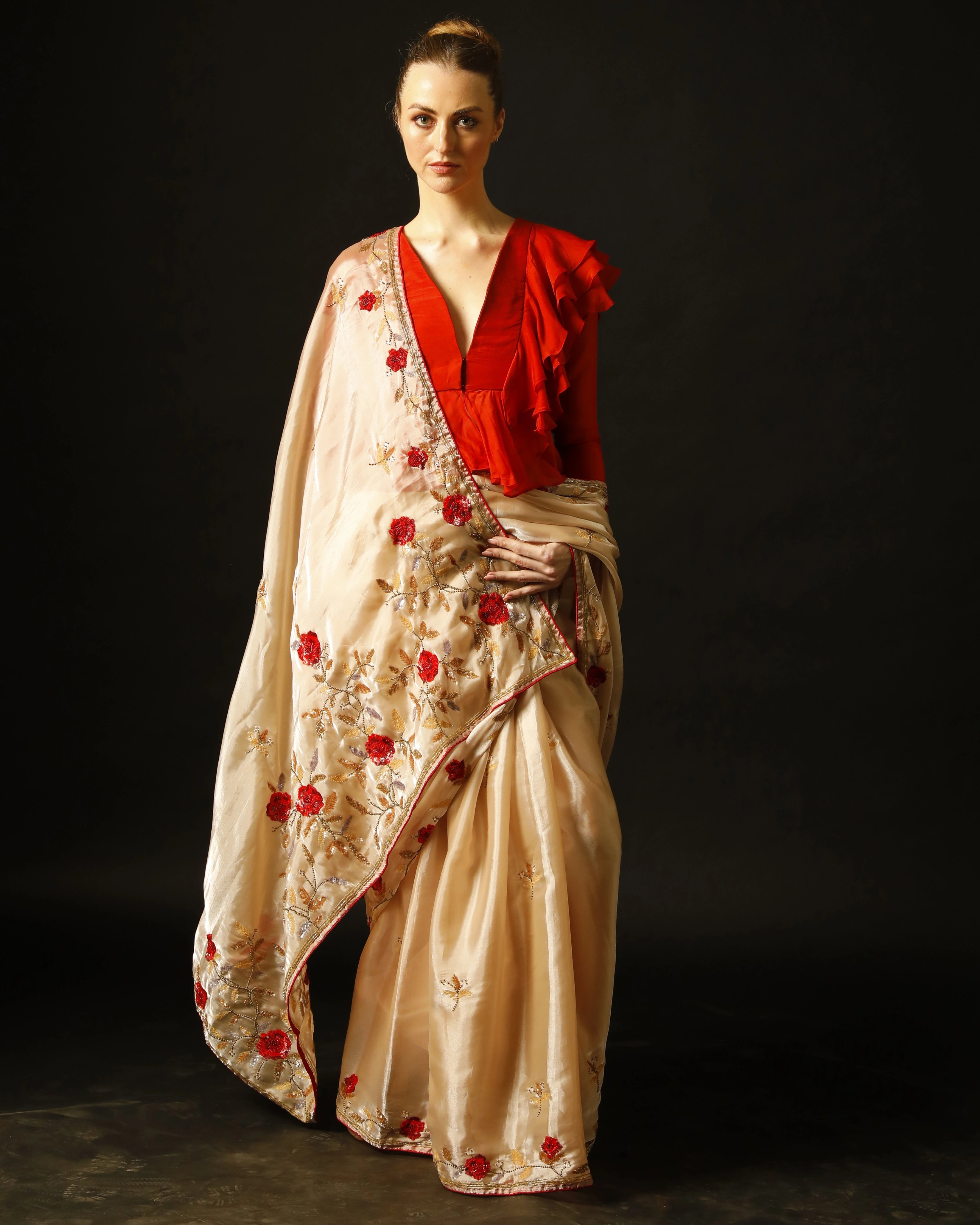 Cream Silk Saree with All-Over Hand Embroidery and Red Tailored Ruffle Blouse