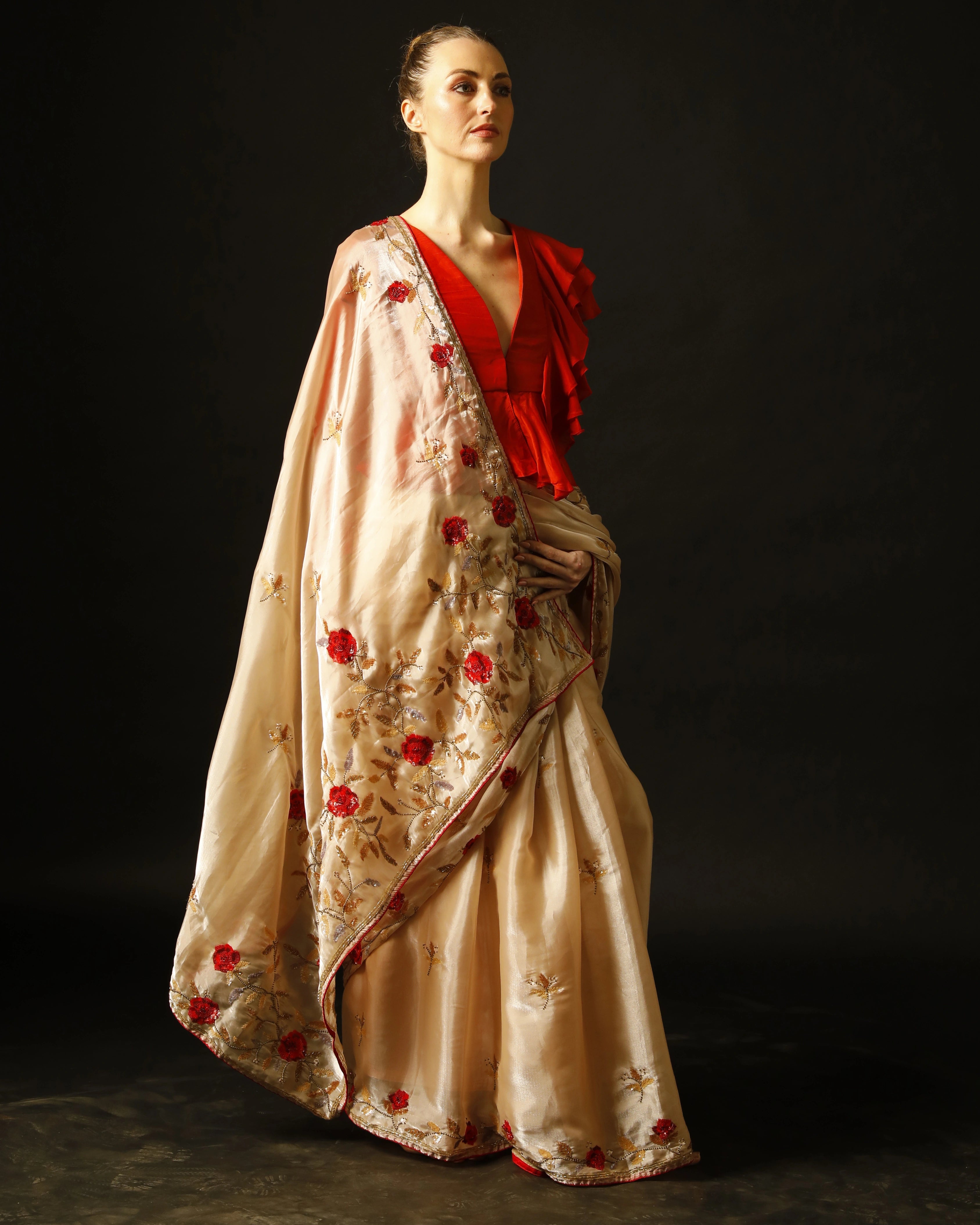 Cream Silk Saree with All-Over Hand Embroidery and Red Tailored Ruffle Blouse