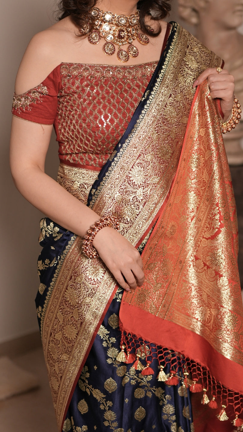 Red and Blue Dual Tone Pure Banarasi Saree with All-Over Floral and Hand Embroidery Border.