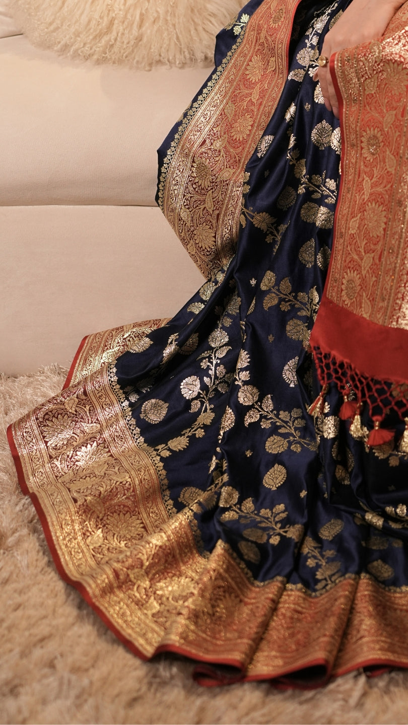 Red and Blue Dual Tone Pure Banarasi Saree with All-Over Floral and Hand Embroidery Border.