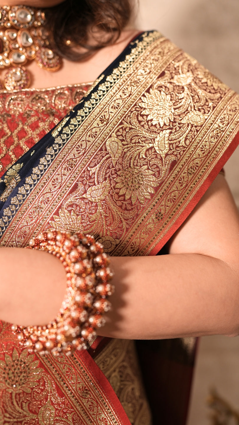Red and Blue Dual Tone Pure Banarasi Saree with All-Over Floral and Hand Embroidery Border.