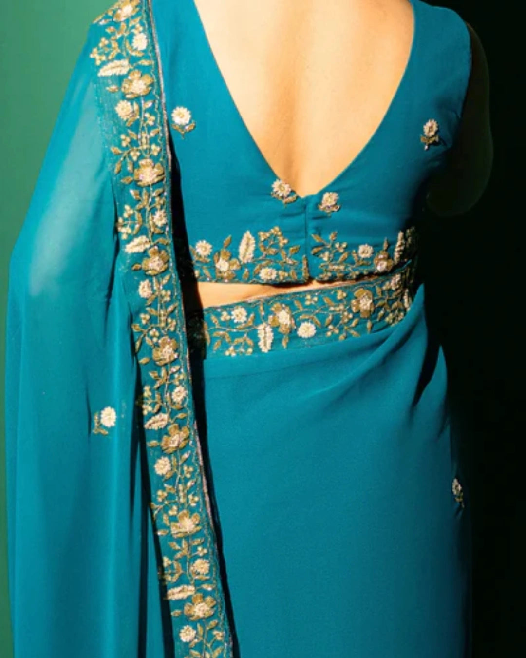 Peacock Blue Hand Embroidered Georgette Saree and Matching Floral Embroidered Blouse