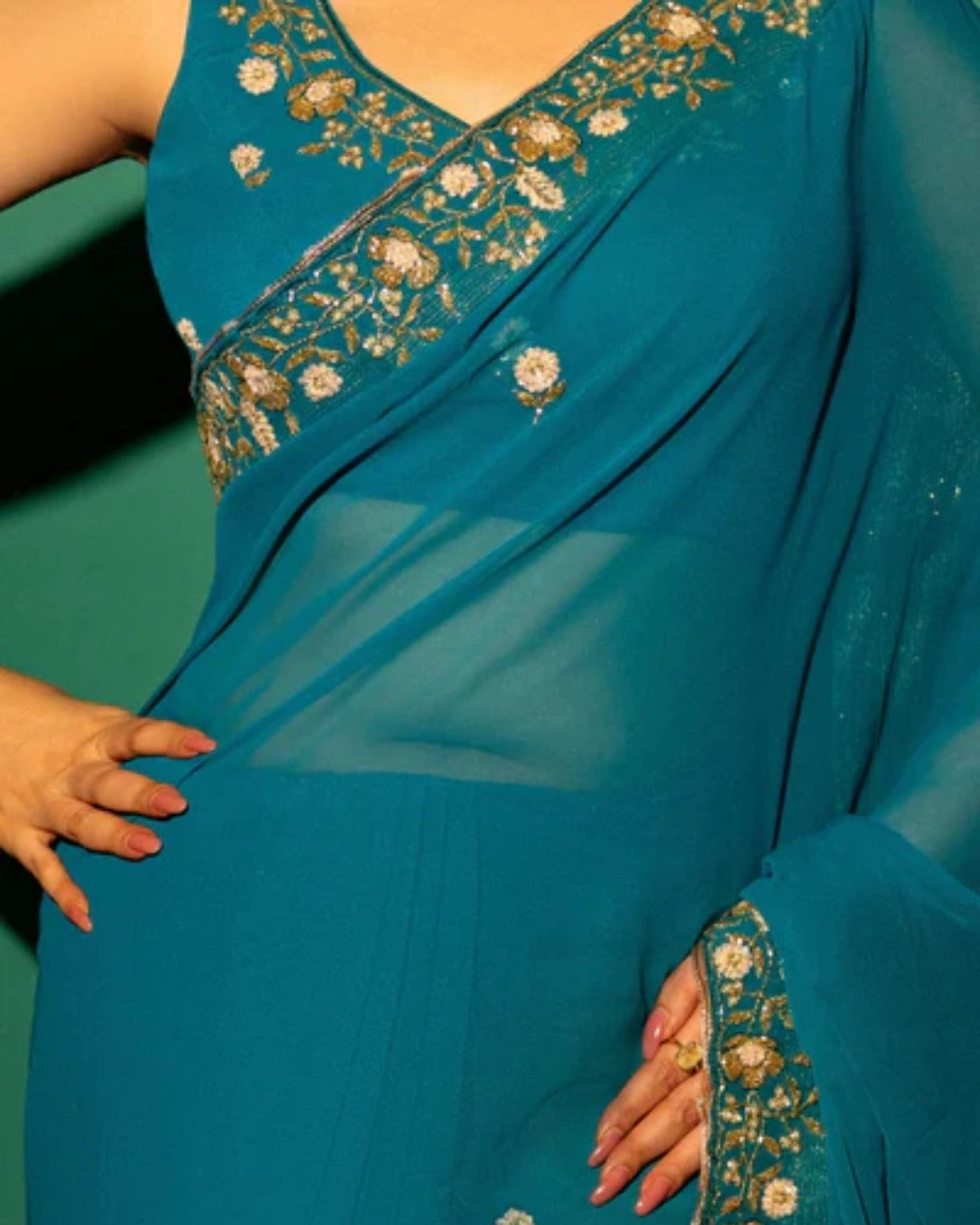 Peacock Blue Hand Embroidered Georgette Saree and Matching Floral Embroidered Blouse