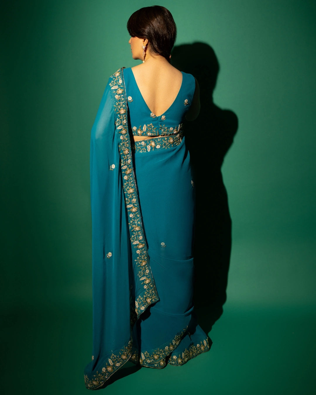 Peacock Blue Hand Embroidered Georgette Saree and Matching Floral Embroidered Blouse