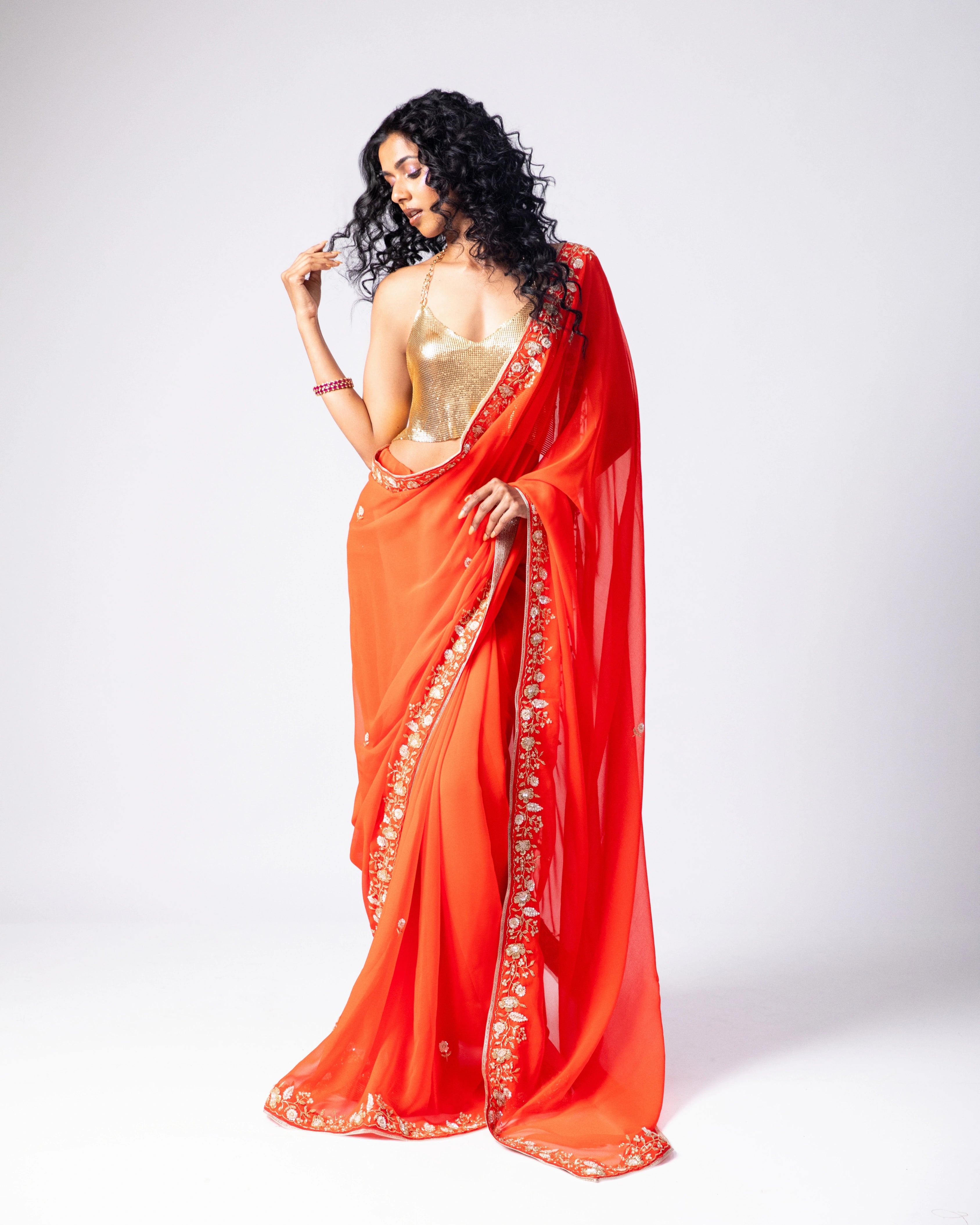 Orange Hand Embroidered Georgette Saree and Gold Metallic Blouse