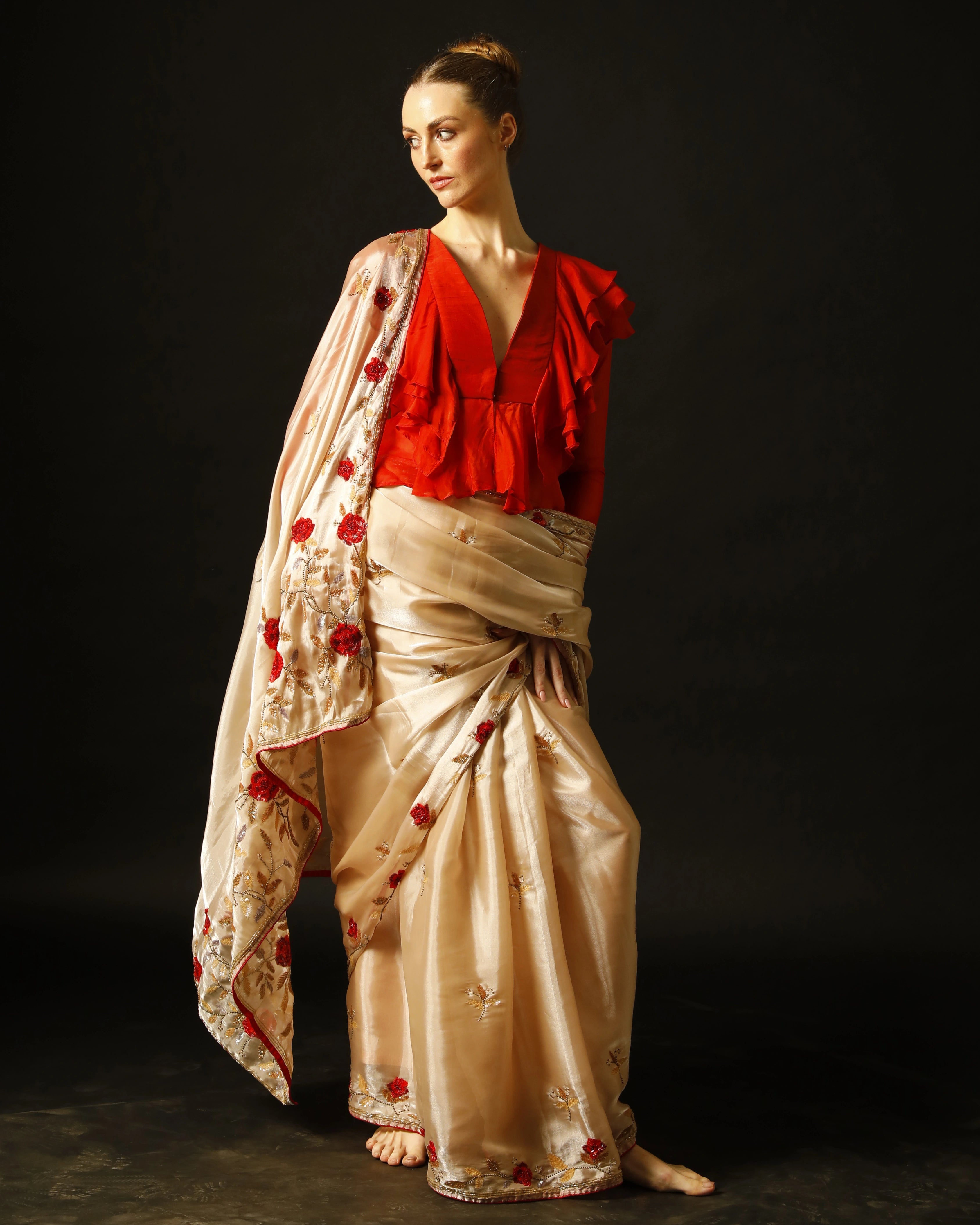 Cream Silk Saree with All-Over Hand Embroidery and Red Tailored Ruffle Blouse