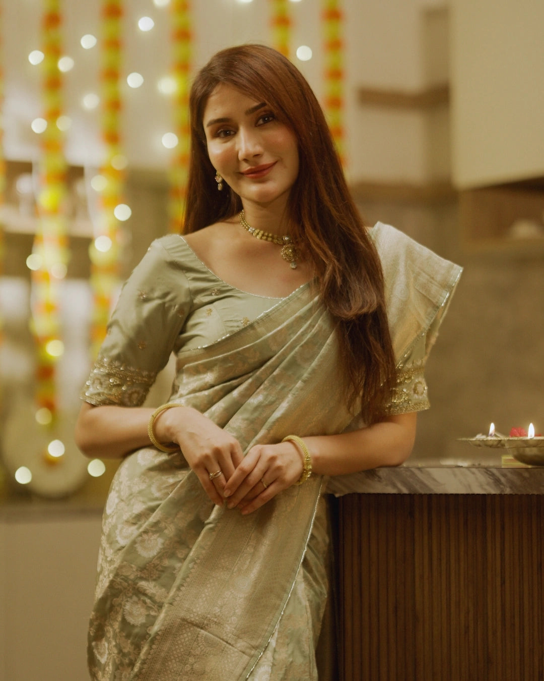 Light Green Pure Banarasi Silk Saree with Gold Floral Design and Matching Blouse.
