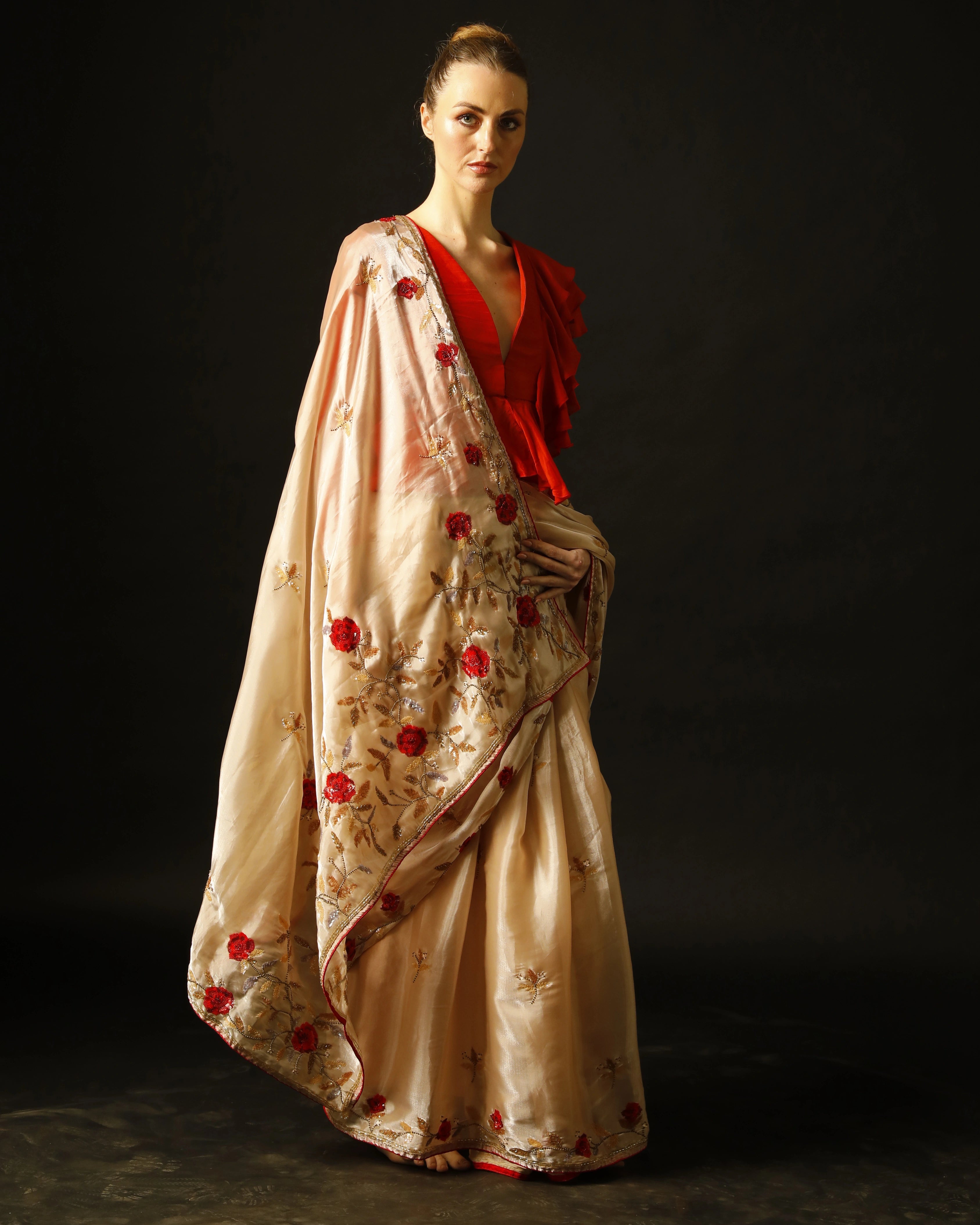 Cream Silk Saree with All-Over Hand Embroidery and Red Tailored Ruffle Blouse